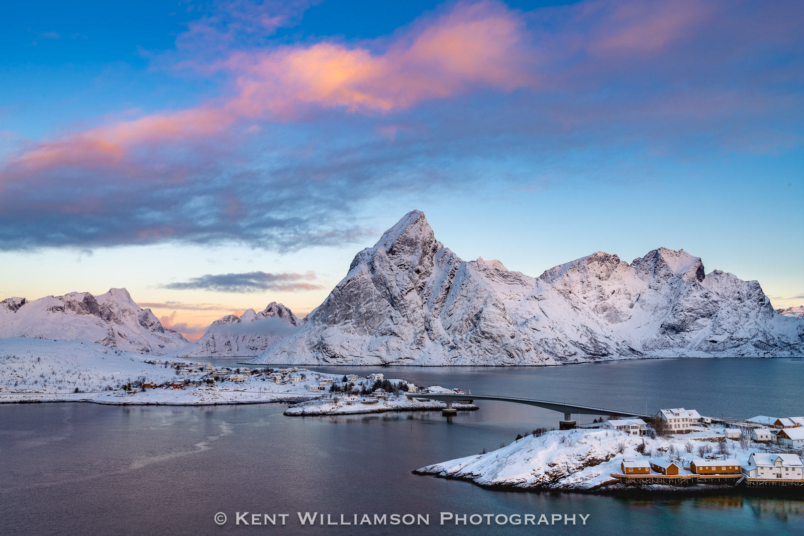 Majestic mountains in winter tower above the fishing villages of Sakrisøy in the Lofoten Islands, Norway, 2019